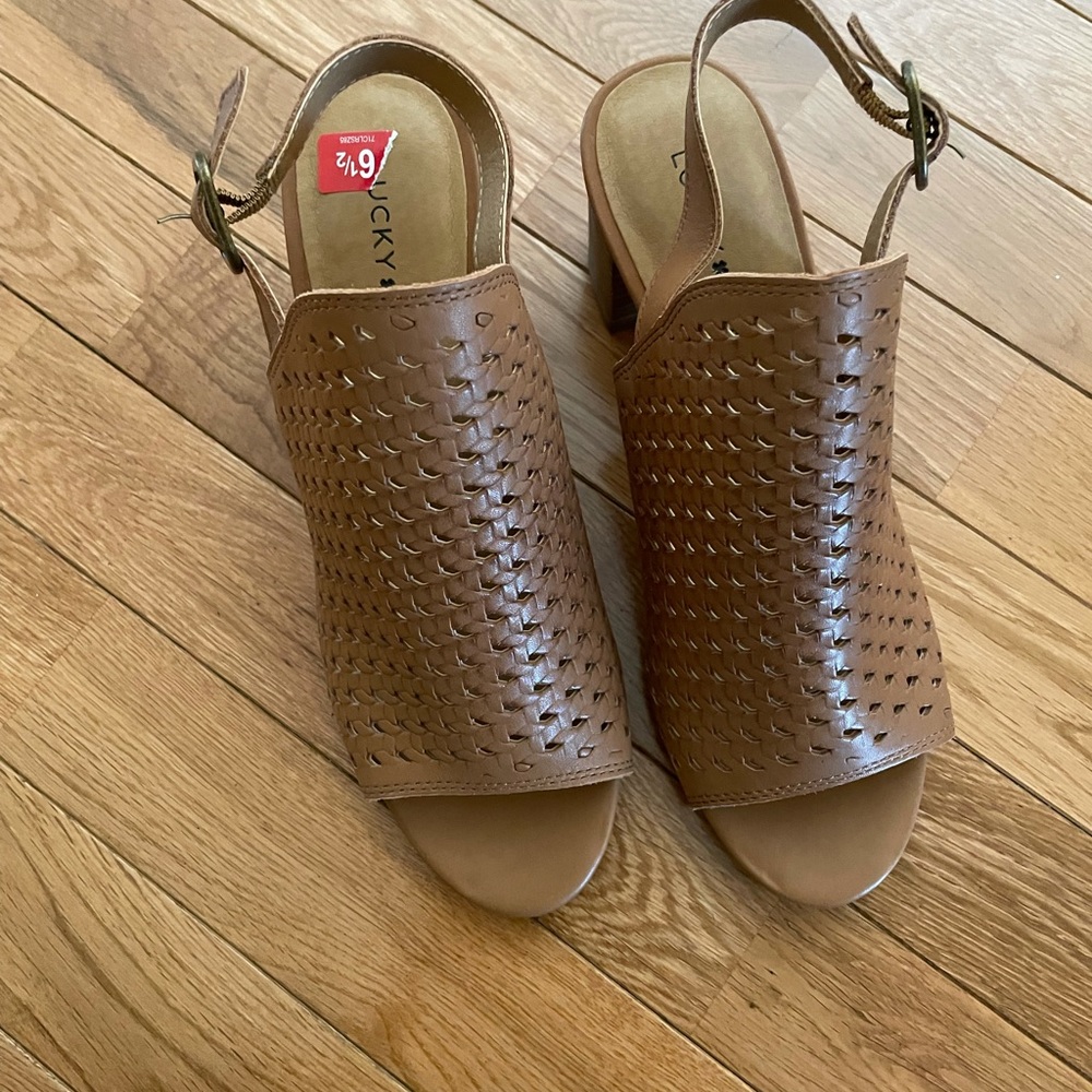 Brand new with box brown Lucky Brand open toed booties. Did not fit me well.